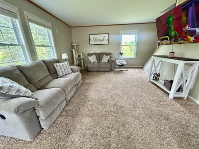 Nestled on two spacious lots totaling 0.79 acres with just one on Sugar Springs Country Club in Michigan - for sale on GolfHomes.com, golf home, golf lot