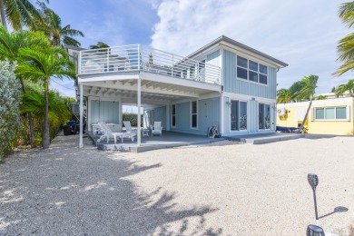 Leave your worries at the door with this contemporary styled on Key Colony Beach Golf Course in Florida - for sale on GolfHomes.com, golf home, golf lot