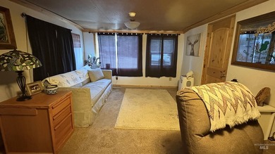 Completely renovated mobile home with cedar siding at Terrace on Terrace Lakes Golf Resort in Idaho - for sale on GolfHomes.com, golf home, golf lot