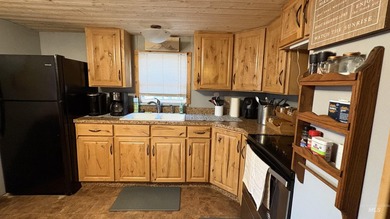 Completely renovated mobile home with cedar siding at Terrace on Terrace Lakes Golf Resort in Idaho - for sale on GolfHomes.com, golf home, golf lot