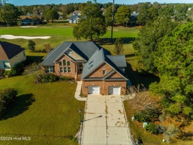 This exquisite custom home is situated on the Azalea 3 Fairway on Brunswick Plantation and Golf Resorts in North Carolina - for sale on GolfHomes.com, golf home, golf lot