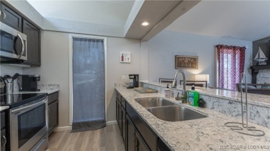 Welcome to Tan Tar A Estates! This 3 bedroom, 4 bathroom home is on The Oaks Golf Course in Missouri - for sale on GolfHomes.com, golf home, golf lot