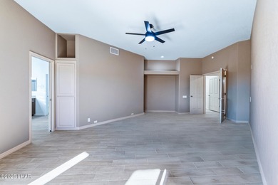 Experience luxury living in this beautiful 3-bedroom, 3-bathroom on London Bridge Golf Course in Arizona - for sale on GolfHomes.com, golf home, golf lot