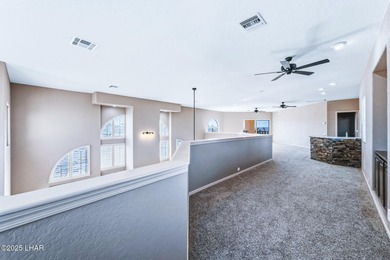 Experience luxury living in this beautiful 3-bedroom, 3-bathroom on London Bridge Golf Course in Arizona - for sale on GolfHomes.com, golf home, golf lot