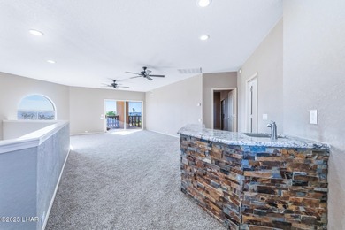 Experience luxury living in this beautiful 3-bedroom, 3-bathroom on London Bridge Golf Course in Arizona - for sale on GolfHomes.com, golf home, golf lot
