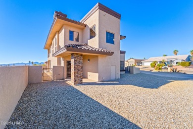 Experience luxury living in this beautiful 3-bedroom, 3-bathroom on London Bridge Golf Course in Arizona - for sale on GolfHomes.com, golf home, golf lot