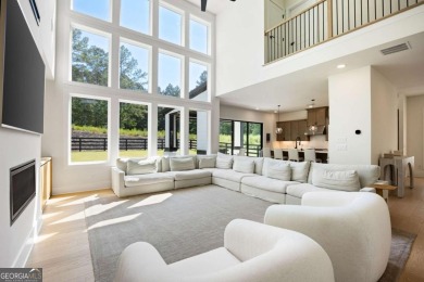 Welcome home to this executive home built by the Toll Brothers on Capital City Club Crabapple in Georgia - for sale on GolfHomes.com, golf home, golf lot