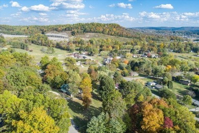 The essence of Tennessee Living! Honest Abe Log Home perched on on Hidden Valley Golf and Country Club in Tennessee - for sale on GolfHomes.com, golf home, golf lot