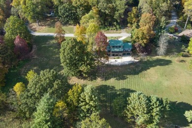 The essence of Tennessee Living! Honest Abe Log Home perched on on Hidden Valley Golf and Country Club in Tennessee - for sale on GolfHomes.com, golf home, golf lot