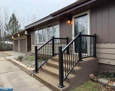 Beautiful home nestled on just over half an acre, only one on Eveleth Municipal Golf Course in Minnesota - for sale on GolfHomes.com, golf home, golf lot