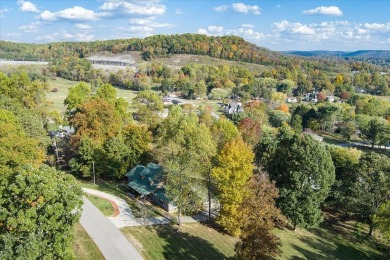 The essence of Tennessee Living! Honest Abe Log Home perched on on Hidden Valley Golf and Country Club in Tennessee - for sale on GolfHomes.com, golf home, golf lot