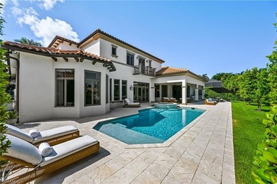 Nestled behind the private gates of Bay Colony Shores, this on Club at Pelican Bay Golf Course in Florida - for sale on GolfHomes.com, golf home, golf lot