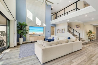 Discover luxury living within the serene coastal modern ambiance on Old Corkscrew Golf Club in Florida - for sale on GolfHomes.com, golf home, golf lot