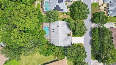 Majestic oak trees and sago palms welcome you to this beautiful on Sugarmill Woods Golf and Country Club in Florida - for sale on GolfHomes.com, golf home, golf lot