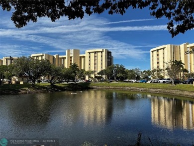 Welcome to this stunning 7th-floor condo in Environ Tower II on Inverrary Country Club in Florida - for sale on GolfHomes.com, golf home, golf lot