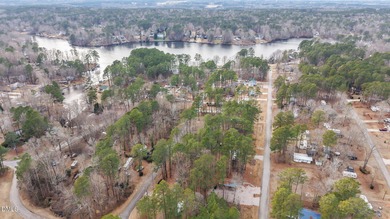The Ultimate Getaway at Lake Royale! Come visit this lake and on River Golf and Country Club at Lake Royale in North Carolina - for sale on GolfHomes.com, golf home, golf lot