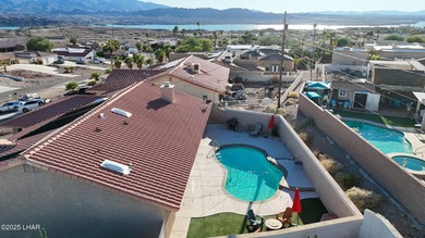 Welcome to your Havasu getaway-where lake views, golf course on London Bridge Golf Course in Arizona - for sale on GolfHomes.com, golf home, golf lot