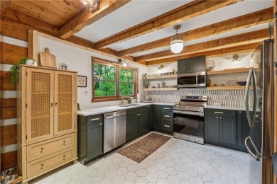 The cozy North Georgia cabin you've been searching for is here on Big Canoe Golf Club - Cherokee in Georgia - for sale on GolfHomes.com, golf home, golf lot