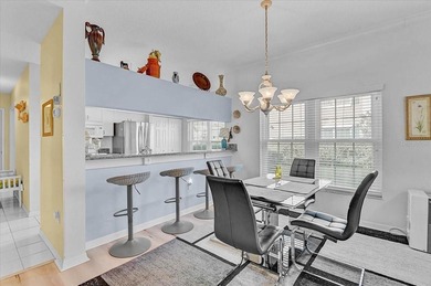 This updated 1st floor end-unit condo is truly move-in ready and on Peridia Golf and Country Club in Florida - for sale on GolfHomes.com, golf home, golf lot