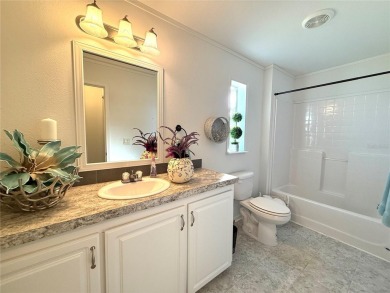 Live the Florida Dream!  This stunning, like-new, 2016 2-bedroom on Apollo Beach Golf and Sea Club in Florida - for sale on GolfHomes.com, golf home, golf lot