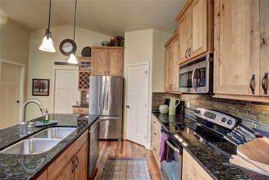 Warm tones & tasteful decor welcome you to this luxury 4bd/3ba on Meadow Lake Golf Resort in Montana - for sale on GolfHomes.com, golf home, golf lot