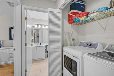 Welcome to this beautiful second-floor end-unit condominium on Peridia Golf and Country Club in Florida - for sale on GolfHomes.com, golf home, golf lot