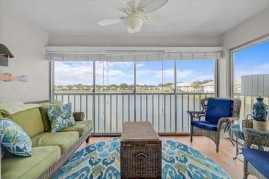 Welcome to this beautiful second-floor end-unit condominium on Peridia Golf and Country Club in Florida - for sale on GolfHomes.com, golf home, golf lot