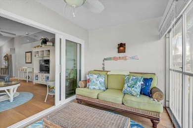 Welcome to this beautiful second-floor end-unit condominium on Peridia Golf and Country Club in Florida - for sale on GolfHomes.com, golf home, golf lot