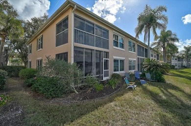 Welcome to this beautiful second-floor end-unit condominium on Peridia Golf and Country Club in Florida - for sale on GolfHomes.com, golf home, golf lot