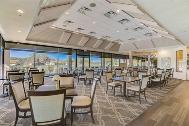 Welcome to this beautiful second-floor end-unit condominium on Peridia Golf and Country Club in Florida - for sale on GolfHomes.com, golf home, golf lot