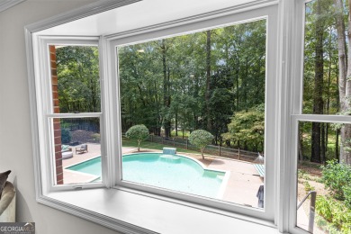Enjoy the sunset views from 103 Lakeshore Drive, a remarkable on Highland Country Club in Georgia - for sale on GolfHomes.com, golf home, golf lot