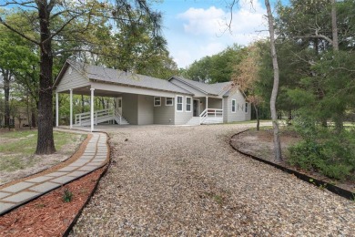 Beautiful 2022 built home in highly sought-after gated community on Holly Lake Ranch Golf Club in Texas - for sale on GolfHomes.com, golf home, golf lot