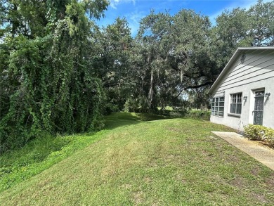 FANTASTIC INVESTMENT OPPORTUNITY TO PICK UP THIS FIXER UPPER IN on Seven Springs Golf and Country Club in Florida - for sale on GolfHomes.com, golf home, golf lot