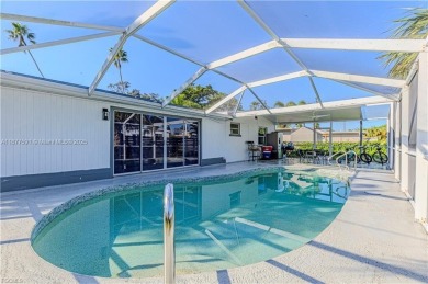 This gorgeous 4 bedroom, 2 bath pool home in the historic Palm on Fort Myers Country Club in Florida - for sale on GolfHomes.com, golf home, golf lot