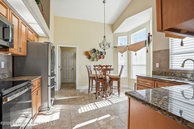 This maintenance-free 3/2/2 villa with pool in Glen Lakes Golf & on Glen Lakes Country Club in Florida - for sale on GolfHomes.com, golf home, golf lot