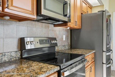 This maintenance-free 3/2/2 villa with pool in Glen Lakes Golf & on Glen Lakes Country Club in Florida - for sale on GolfHomes.com, golf home, golf lot