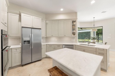 Updated, custom-built home nestled within the highly desirable on Regatta Bay Golf and Country Club in Florida - for sale on GolfHomes.com, golf home, golf lot