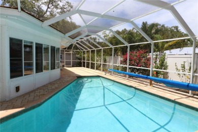 There is so much to love about this beautiful 3 bedroom, 2 bath on The Dunedin Country Club in Florida - for sale on GolfHomes.com, golf home, golf lot