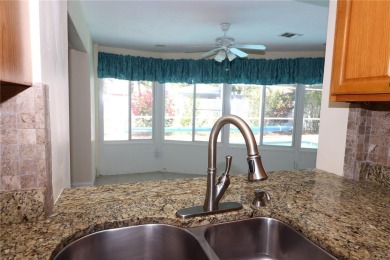 There is so much to love about this beautiful 3 bedroom, 2 bath on The Dunedin Country Club in Florida - for sale on GolfHomes.com, golf home, golf lot