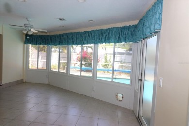 There is so much to love about this beautiful 3 bedroom, 2 bath on The Dunedin Country Club in Florida - for sale on GolfHomes.com, golf home, golf lot