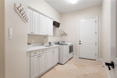 Updated, custom-built home nestled within the highly desirable on Regatta Bay Golf and Country Club in Florida - for sale on GolfHomes.com, golf home, golf lot