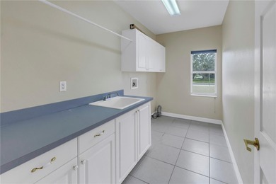 Move-in ready pool home in Long Bayou Estates! This on Seminole Lake Country Club in Florida - for sale on GolfHomes.com, golf home, golf lot