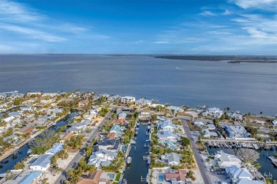 Waterfront Luxury Meets Eco-Friendly Living on Key Royale! on Key Royale Club in Florida - for sale on GolfHomes.com, golf home, golf lot