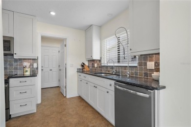 Welcome to your new home where comfort meets style in every on Mainlands Golf Club in Florida - for sale on GolfHomes.com, golf home, golf lot