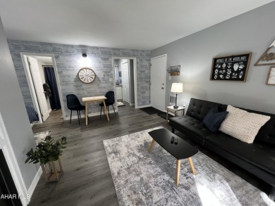 Perfect end unit and successful rental.  Turnkey 1st floor on Blue Knob Rec Area Golf Course in Pennsylvania - for sale on GolfHomes.com, golf home, golf lot