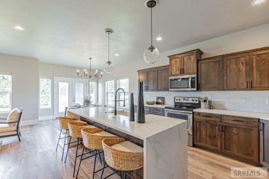 Discover this spacious 6-bedroom, 3-bathroom home nestled in the on Teton Lakes Golf Courses in Idaho - for sale on GolfHomes.com, golf home, golf lot