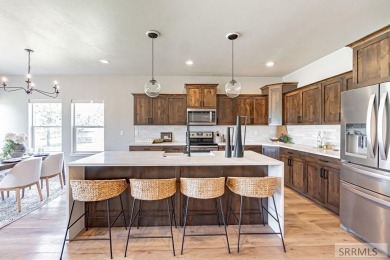 Discover this spacious 6-bedroom, 3-bathroom home nestled in the on Teton Lakes Golf Courses in Idaho - for sale on GolfHomes.com, golf home, golf lot