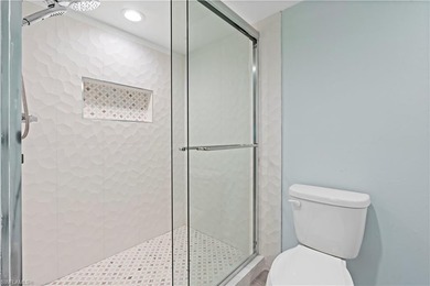 2 Bed + Den | 2 Bath | End-Unit Condo with Water & Golf Course on The Forest Country Club in Florida - for sale on GolfHomes.com, golf home, golf lot