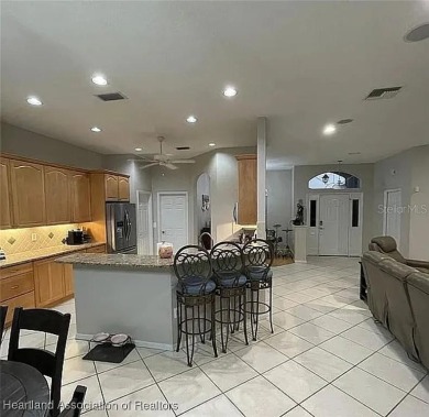 Enormous 3-Bedroom, 2-Bathroom Custom Home + Den in The on Sun n Lake Golf and Country Club in Florida - for sale on GolfHomes.com, golf home, golf lot