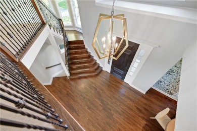 Welcome to this exquisite 1.5-story residence in the prestigious on Loch Lloyd Country Club in Missouri - for sale on GolfHomes.com, golf home, golf lot